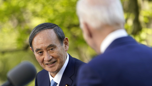 US President Joe Biden, accompanied by Japanese Prime Minister Yoshihide Suga, speaks at a news conference in the Rose Garden of the White House.