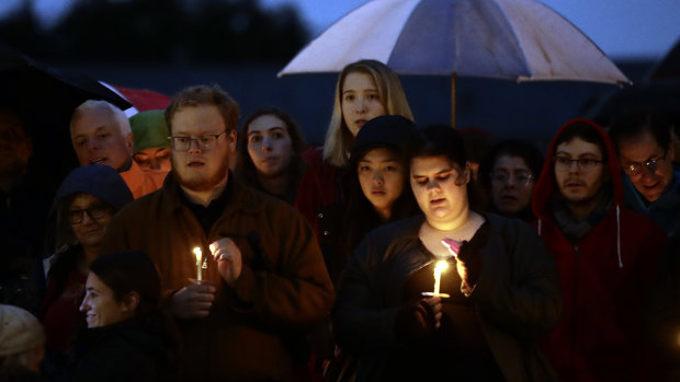 People hold candles as they gather for a vigil in the aftermath of a deadly shooting at the Tree of Life Congregation, in the Squirrel Hill neighborhood of Pittsburgh.