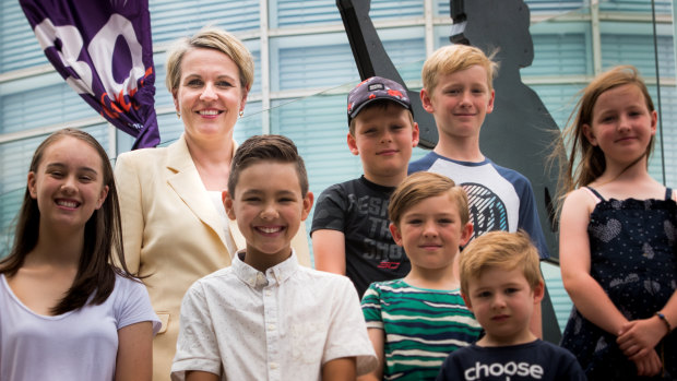 Deputy Opposition Leader Tanya Plibersek, pictured with school children at Questacon in Canberra, is urging universities to toughen their admission standards for teaching degrees or face a mandatory cap on student numbers under a Labor government.