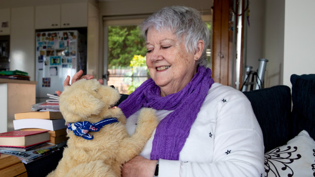 Bobby Redman with her robot dog, Benji.