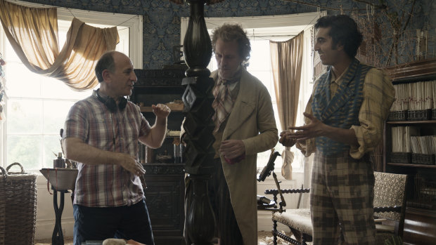 Armando Iannucci with Hugh Laurie and Dev Patel on the set of The Personal History of David Copperfield. 