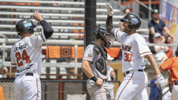 Canberra Cavalry's Zach Wilson and Michael Crouse celebrate.