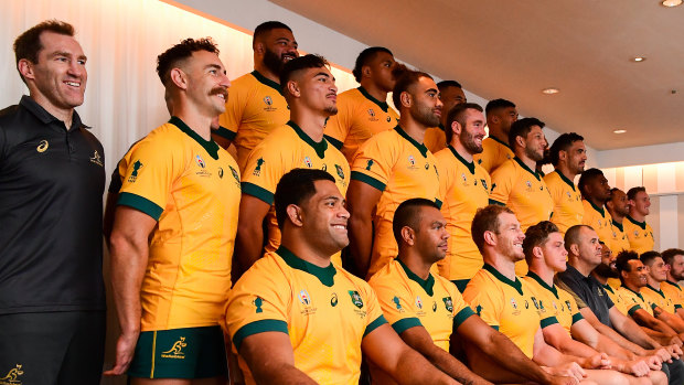 Smile: The Wallabies have their team photo taken ahead of Saturday's clash with England. 