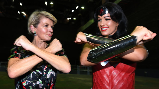 Foreign Affairs Minister Julie Bishop strikes a pose with Wonder Woman after announcing the funding boost at Village Roadshow Studios on the Gold Coast.