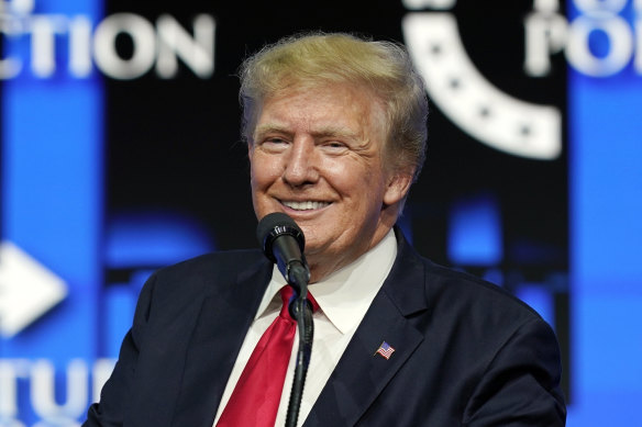 Former US president Donald Trump smiles while speaking to supporters at a Turning Point Action gathering in Phoenix, Arizona, in July.