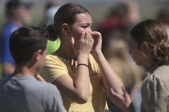 Students react in horror after a school shooting at Rigby Middle School in Rigby, Idaho on Thursday.