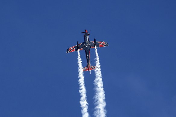 A Pilatus PC-21, piloted by Flight Lieutenant Greg Nichol, soars over St Kilda on Monday.