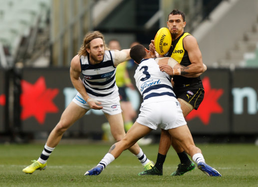 Brandan Parfitt lays a tackle on Sydney Stack.