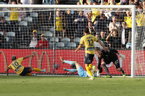 The Mariners celebrate what was ultimately deemed an Anthony Caceres own goal.