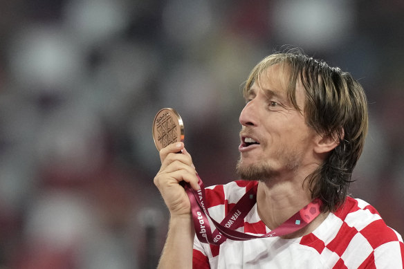 Croatia’s Luka Modric shows off his bronze medal.