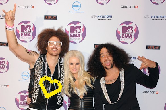 Lauren Bennett between Redfoo (left) and Sky Blu (right) from LMFAO.