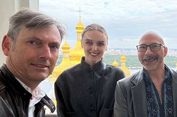 Europe correspondent David Crowe in Kyiv with Australian Ukrainians Anastasiya Byesyedina, a historian, and Julian Knysh, a filmmaker.