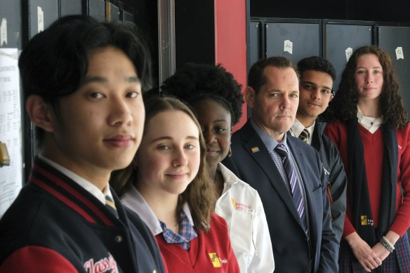 Reservoir High school students Andy Ngo, Hayley Corneille, Rumbi Mutezos, Dhruv Verma and
Charlotte Reginato, with
principal Andrew McNeil.