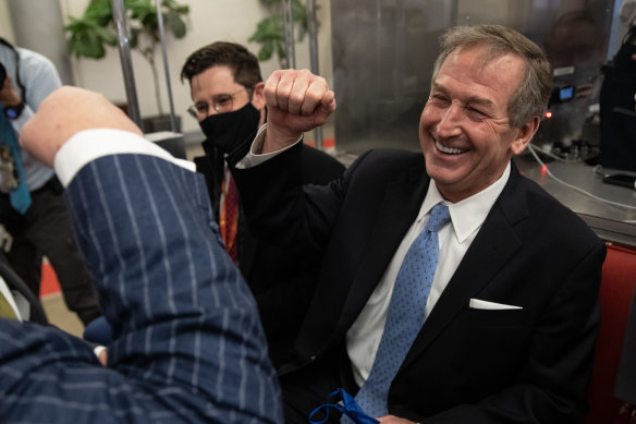 Michael van der Veen, defence attorney for Donald Trump, fist bumps at the US Capitol on Saturday after the impeachment trial ended in a not guilty verdict.
