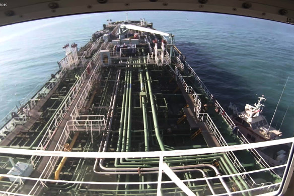 This CCTV image provided by South Korea's Taikun Shipping Co shows the moment the South Korean tanker was captured by an armed Iranian Revolutionary Guard speedboat, right, on the waters of the Persian Gulf and the Strait of Hormuz on January 4.