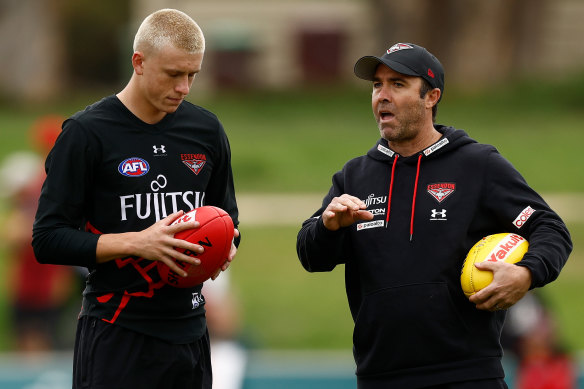 Nate Caddy and Brad Scott at Essendon training.