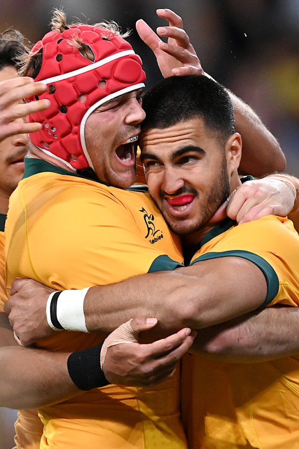 Harry Wilson and Tom Wright celebrate a stunning victory over the All Blacks in Brisbane.
