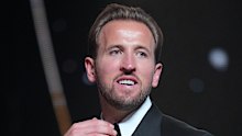 Harry Kane wins the player of the year trophy.