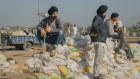 Protesters take a break near the front line of a conflict between farmers and police in Rajpura, India, on Thursday.