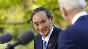 US President Joe Biden, accompanied by Japanese Prime Minister Yoshihide Suga, speaks at a news conference in the Rose Garden of the White House.