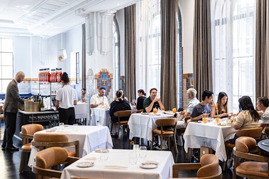 Wonderful, natural light gleams on black floorboards of The Lodge Dining Room on level one of Rodd & Gunn’s flagship store.