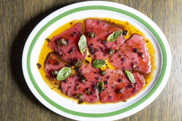 Tuna carpaccio with tomato, olive crumb and capers.

