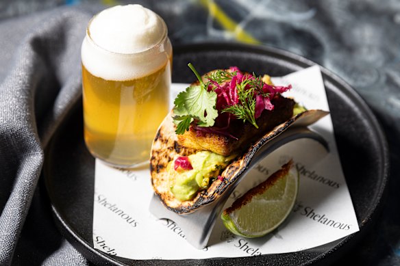 Barramundi taco with avocado cream.