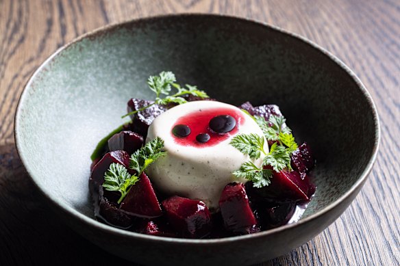 A seasonal dessert of macadamia ice-cream, fig leaf oil, plum syrup, white chocolate and puffed grains.