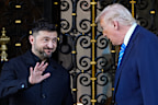President Donald Trump greets Ukraine’s President Volodymyr Zelensky at his Mar-a-Lago club, on Sunday