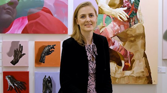 Artist Marie Pol with her work on display at the Affordable Art Fair in Sydney.