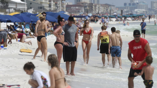Beachgoers enjoy a sunny day in Florida this week.