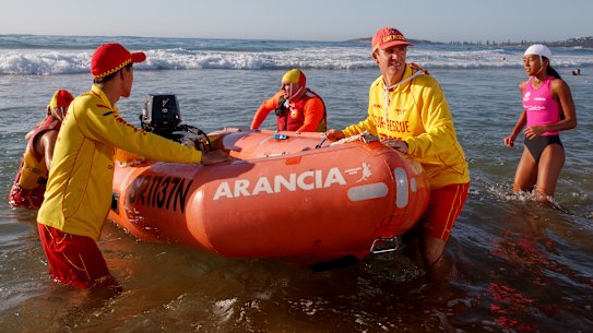 North Narrabeen SLSC Club patrol captain Adrian Hill with volunteers Jason Perry (front left) Jacque Grimes, Jacinta Perry and John Beaumont hit the water.