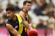 ELBOURNE, AUSTRALIA - MAY 14: Marlion Pickett of the Tigers
 runs with the ball during the round nine AFL match between the Hawthorn Hawks and the Richmond Tigers at Melbourne Cricket Ground on May 14, 2022 in Melbourne, Australia. (Photo by Darrian Traynor/AFL Photos/via Getty