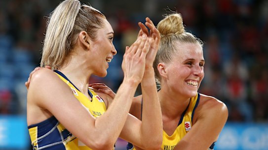Helen Housby (left) and Maddy Turner celebrate victory against the Magpies.