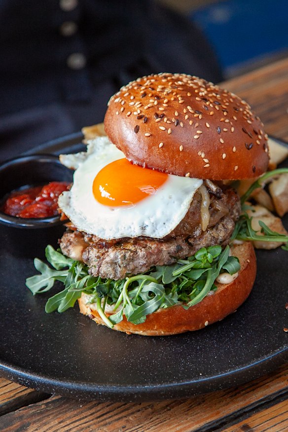 Beef burger with maple bacon, fried egg, bush tomato relish and truffle aioli.