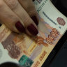 Once mocked by Biden, Russia’s rouble emerges from the ashes