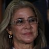 Venezuelan first lady Cilia Flores stands behind her husband Nicolas Maduro at a 2019 press conference at the Miraflores Palace.