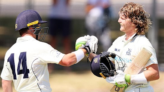 Marcus Harris congratulates Will Pucovski on his latest century on Sunday.