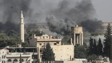 Smoke rises over the Syrian town of Ras Al Ain.