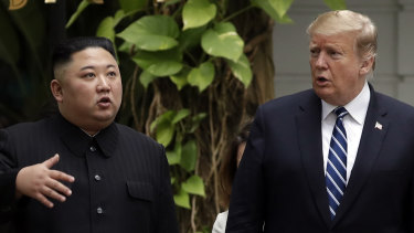 Kim Jong-un and Donald Trump go for a walk in the garden after their first meeting in Hanoi.