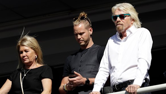 Richard Branson, right, with his son Sam Branson and wife Joan Templeman join crowds at Obama's speech.