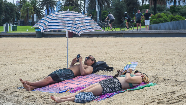 Many went maskless at St Kilda beach on Tuesday.