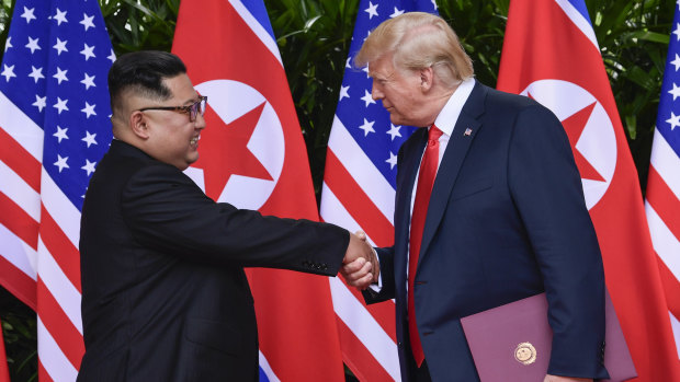North Korean leader Kim Jong-un, left, and US President Donald Trump shake hands at the conclusion of their meetings on Sentosa Island in Singapore in June 2018.