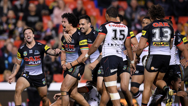 Making hay: Corey Harawira-Naera of the Panthers celebrates with teammates after another score.
