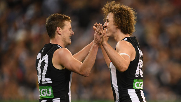 Will Hoskin-Elliott (R) and Chris Mayne (L) celebrate during the Pies win over the Blues. 