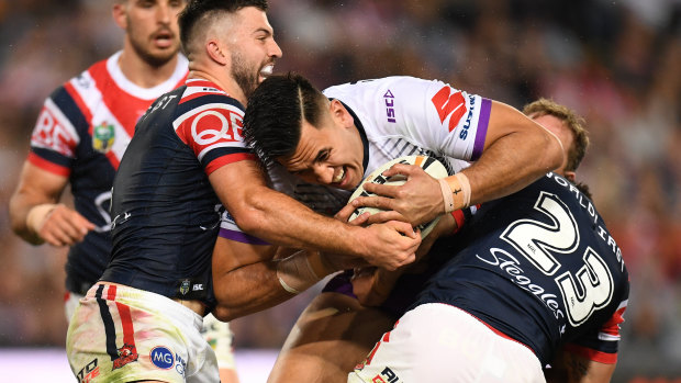 Pain barrier: A true test of Cronk's pain barrier as he leads with his injured left shoulder on Nelson Asofa-Solomona.