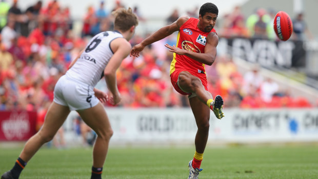 Joel Wilkinson, a Nigerian-born Gold Coast player, took his complaints about racism in the AFL to the Human Rights Commission.