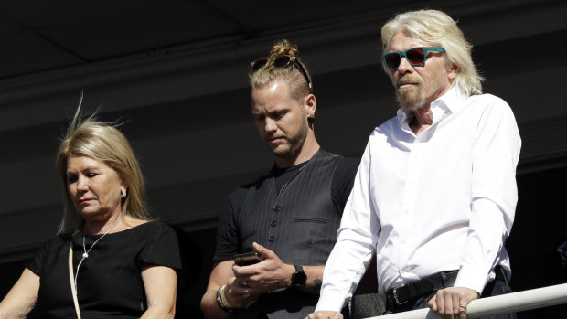 Richard Branson, right, with his son Sam Branson and wife Joan Templeman join crowds at Obama's speech.