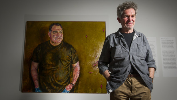 Artist Peter Hudson and his portrait of Mal Meninga. 