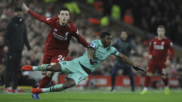Soaring: Liverpool's Andy Robertson (left) is part of a deeper, more dangerous side currently topping the table.
